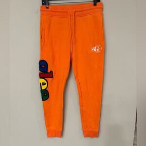 Ladies S/P Sniper Gang Orange Joggers with Multicolor “GLEE” down the leg